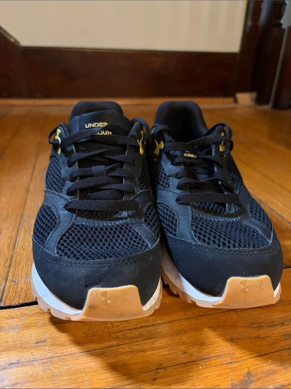 Under Armour Black Athletic Shoes with Gold Logo Accents